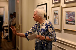 Starr speaking with the Oberlin visitors at the Cosmos Club Exhibit